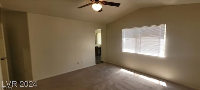 unfurnished bedroom featuring lofted ceiling, carpet floors, and ceiling fan