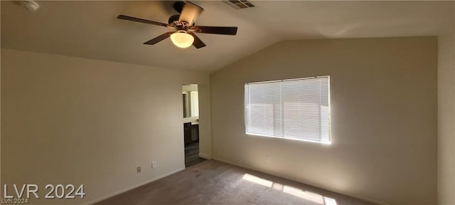 empty room with lofted ceiling, ceiling fan, and carpet