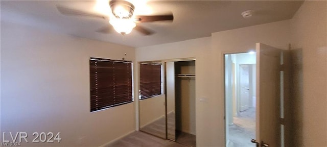 unfurnished bedroom with a closet and ceiling fan