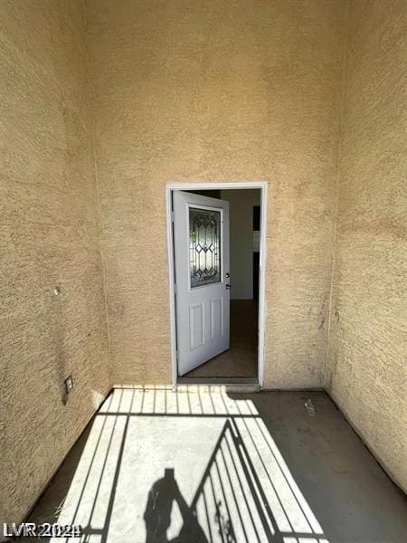 property entrance with stucco siding