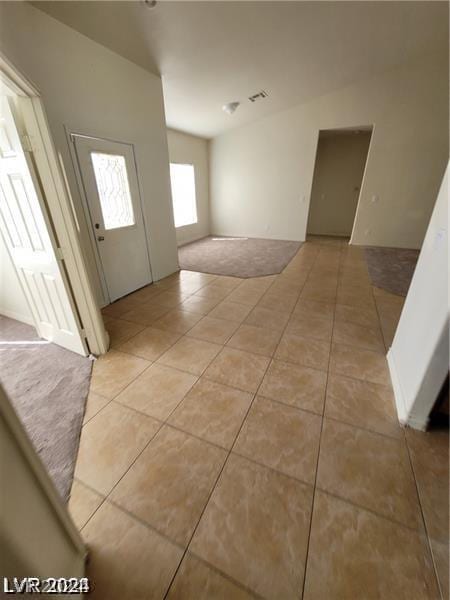 foyer entrance with light tile patterned floors