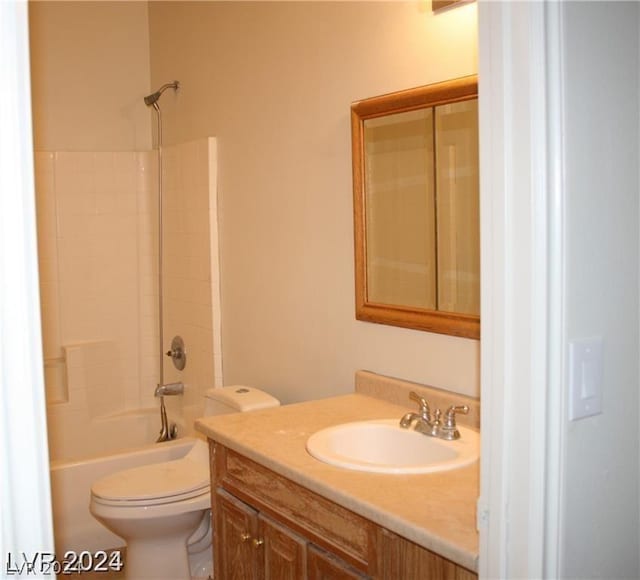 bathroom with toilet, vanity, and bathtub / shower combination