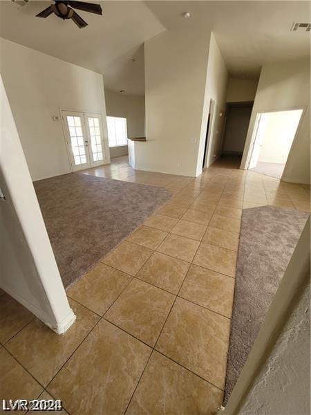 unfurnished room with light tile patterned flooring, visible vents, and a ceiling fan