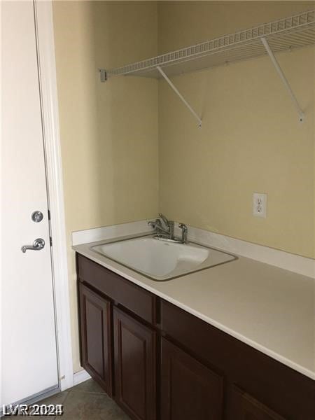 bathroom with vanity and tile patterned flooring