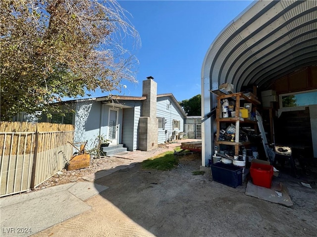 exterior space with entry steps and fence