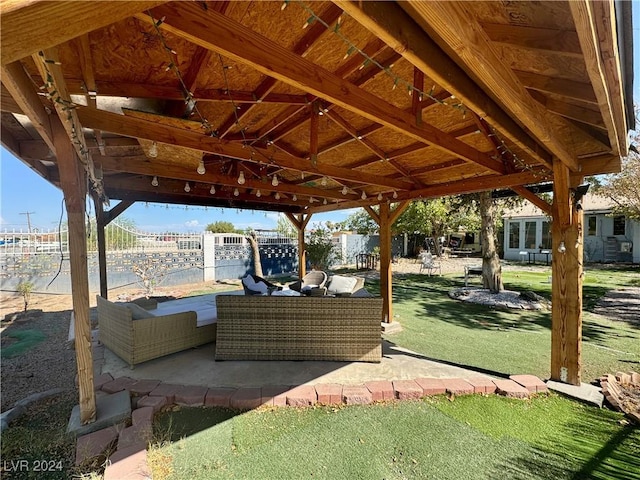 view of patio featuring fence and an outdoor hangout area