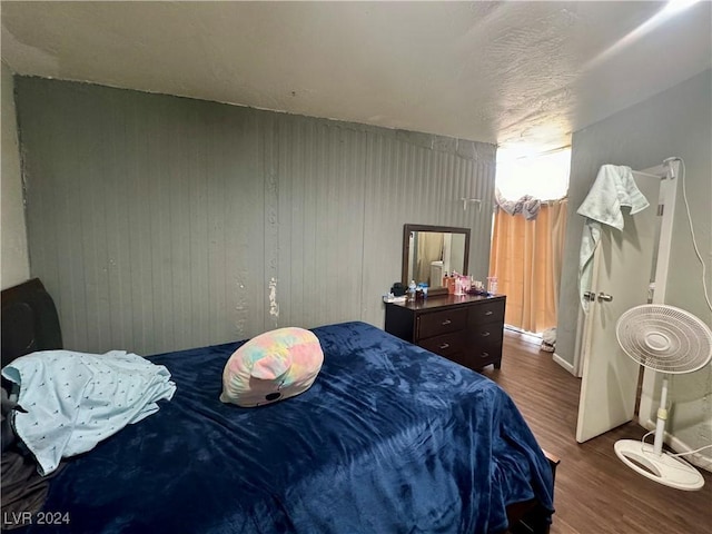 bedroom featuring dark wood-type flooring