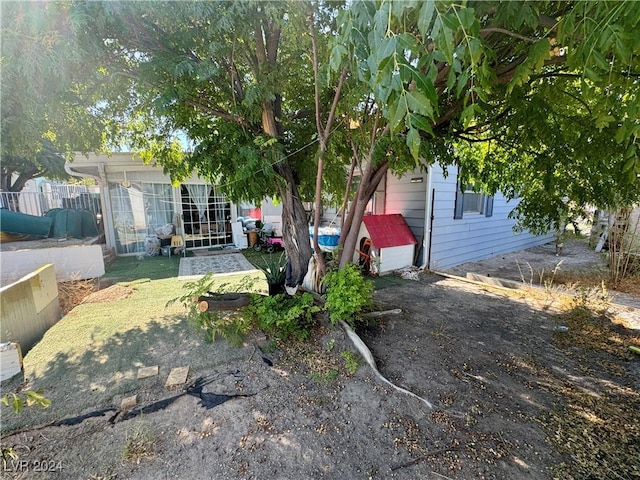 view of front of house featuring fence