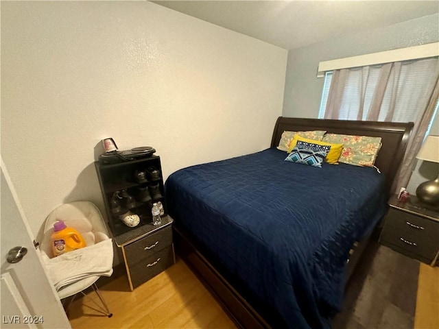 bedroom featuring light wood finished floors