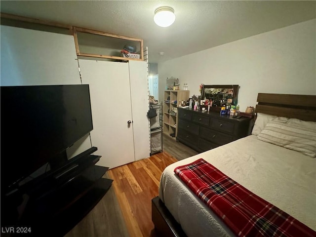 bedroom featuring wood finished floors