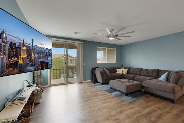 living room with ceiling fan and hardwood / wood-style floors