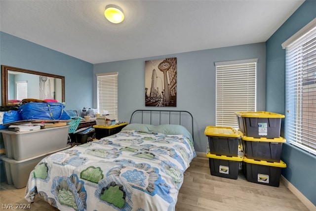 bedroom with light hardwood / wood-style floors