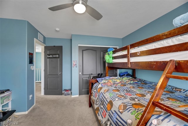 carpeted bedroom featuring ceiling fan