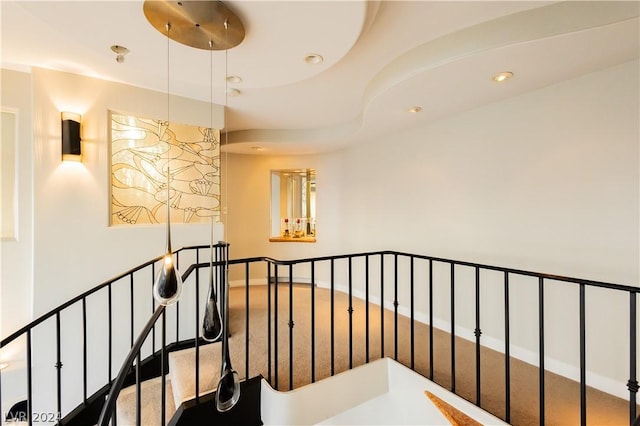 hall featuring recessed lighting, an upstairs landing, and baseboards