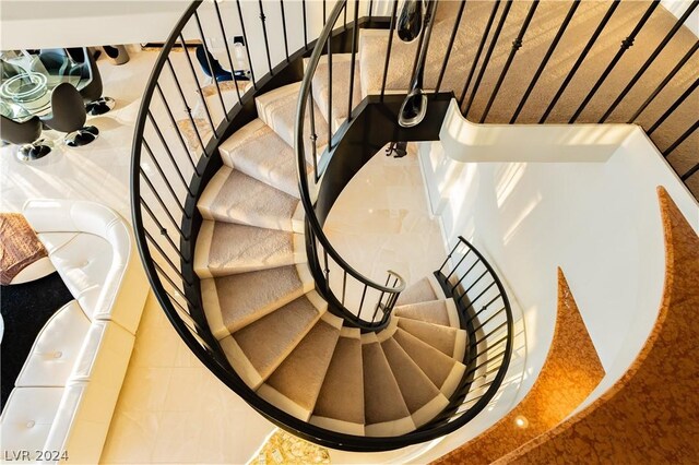 staircase with tile patterned flooring