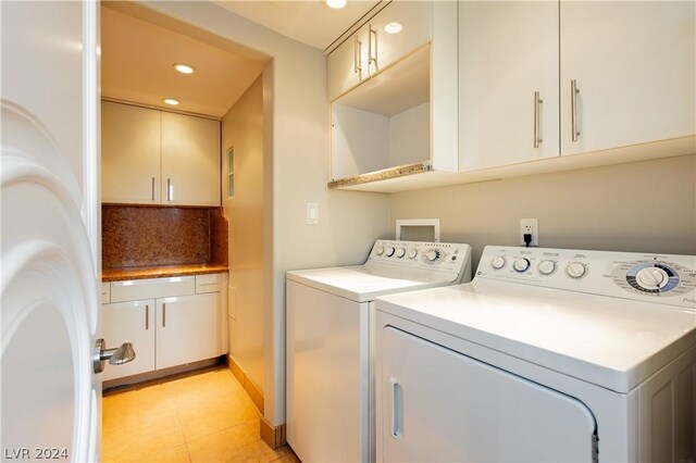 washroom with light tile patterned floors and independent washer and dryer