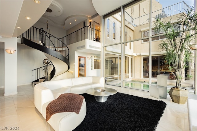 living room with a high ceiling