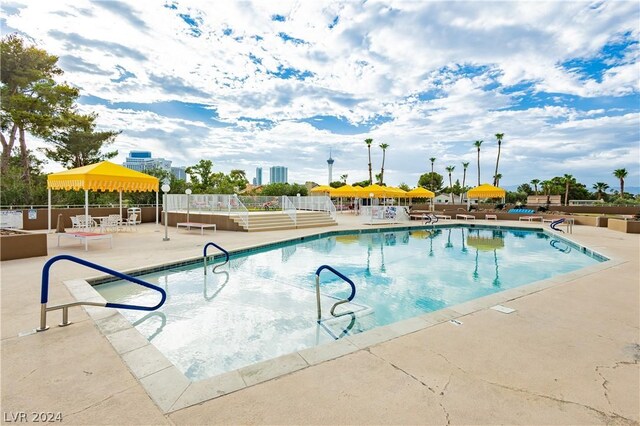 view of swimming pool featuring a patio area