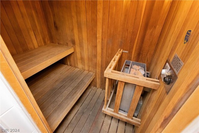 view of sauna with wood walls