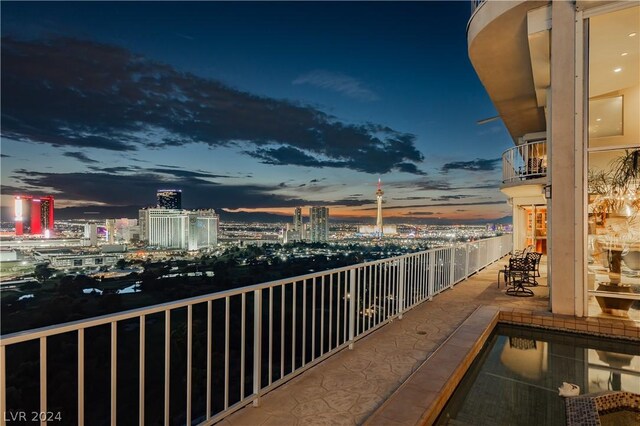 view of balcony at dusk