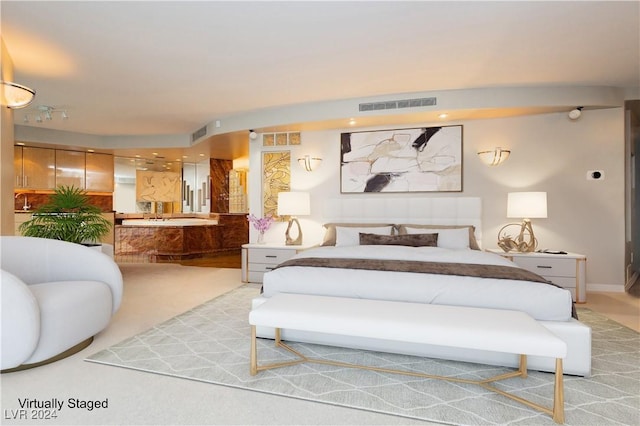 bedroom with light colored carpet and visible vents