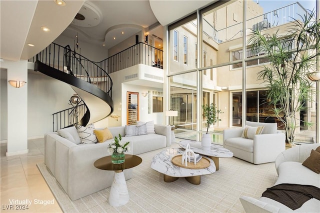 tiled living room with stairway and recessed lighting