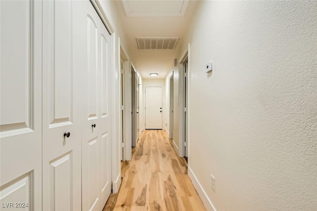 corridor featuring light hardwood / wood-style flooring