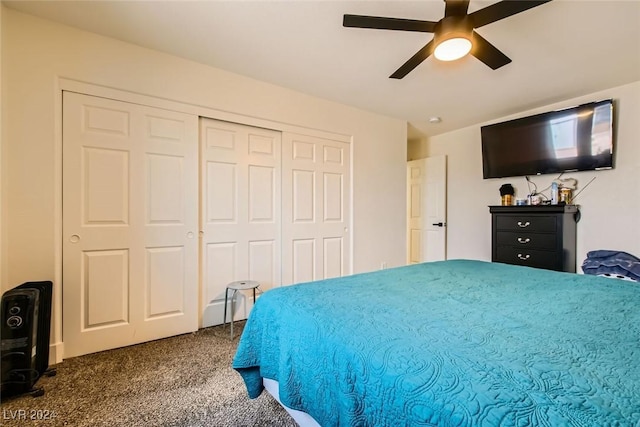 carpeted bedroom featuring ceiling fan and a closet