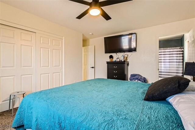 carpeted bedroom with ceiling fan and a closet