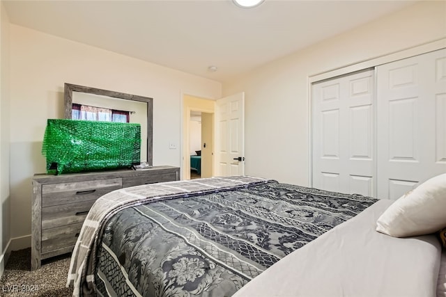 carpeted bedroom with a closet