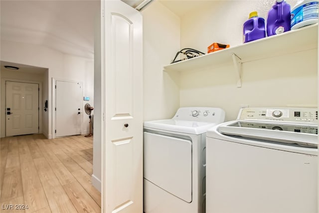 washroom with light hardwood / wood-style flooring and independent washer and dryer