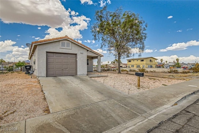 view of front of property with a garage