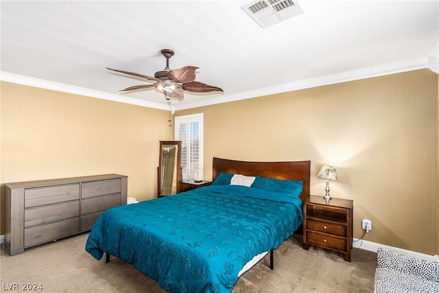 bedroom with crown molding, light colored carpet, and ceiling fan