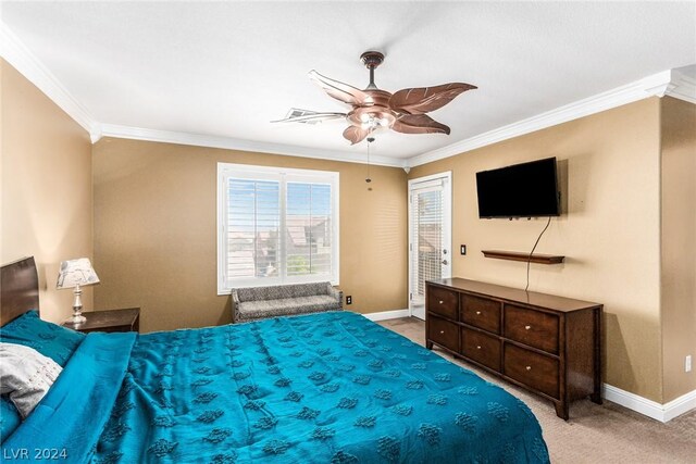 bedroom featuring light carpet, ceiling fan, and crown molding