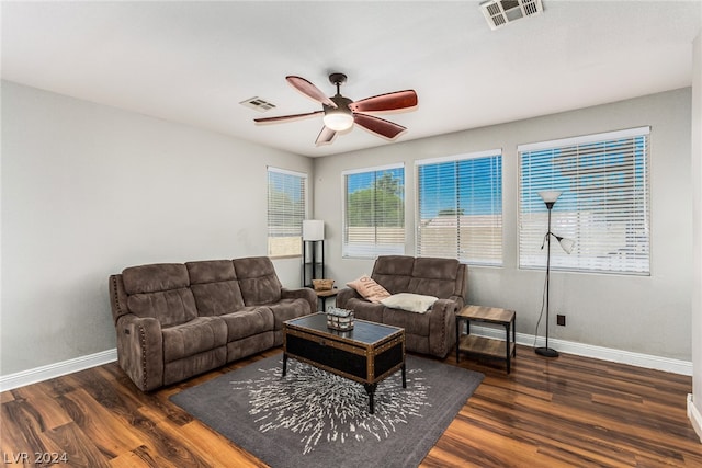 living room with wood-type flooring and ceiling fan