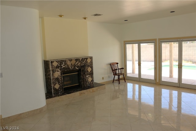 living room with light tile patterned flooring and a premium fireplace