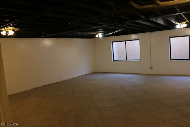 basement featuring tile patterned flooring