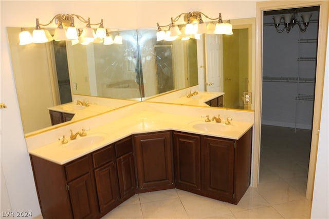 bathroom featuring tile patterned flooring and dual vanity