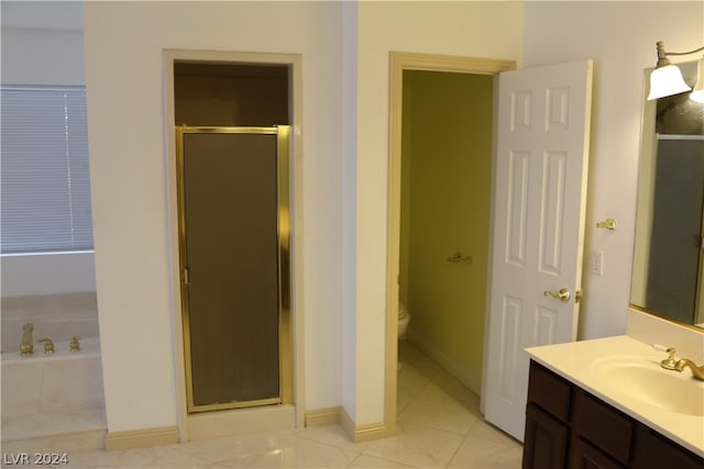 full bathroom with tile patterned floors, plus walk in shower, toilet, and vanity