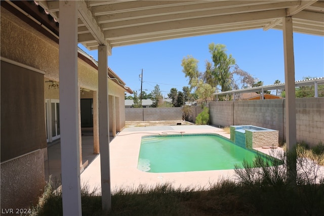 view of swimming pool featuring a patio