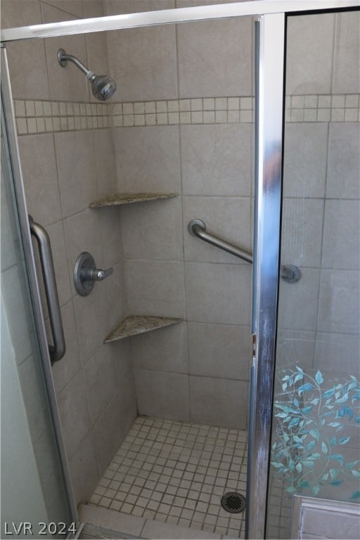 bathroom with an enclosed shower