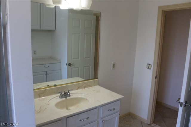 bathroom featuring tile patterned flooring and vanity