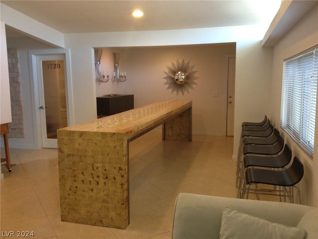 bar with light tile patterned flooring