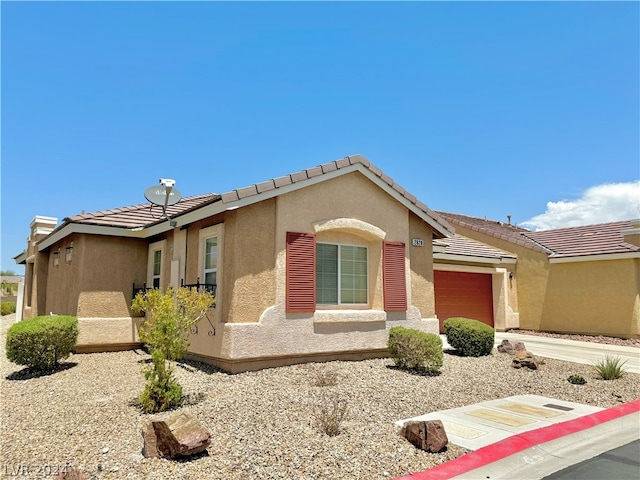 single story home with a garage