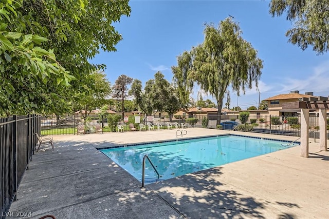 5102 Village Dr Unit 49, Las Vegas, NV 89142 - community pool with a patio area and fence
