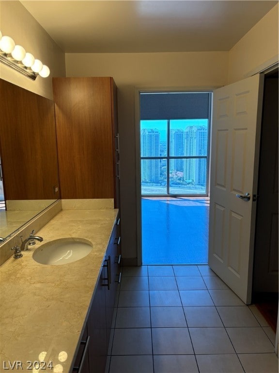 bathroom with vanity and tile patterned flooring