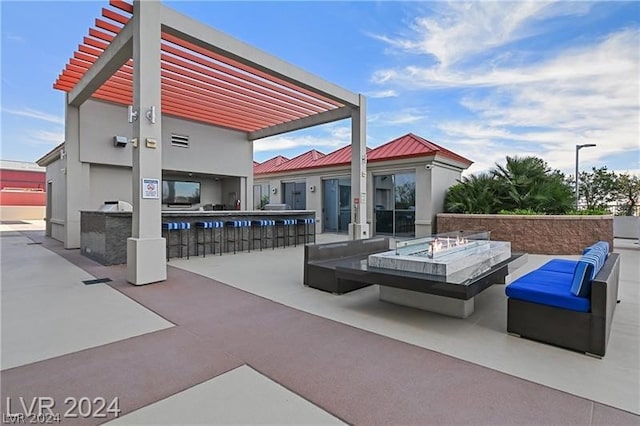 view of patio / terrace with area for grilling and an outdoor fire pit