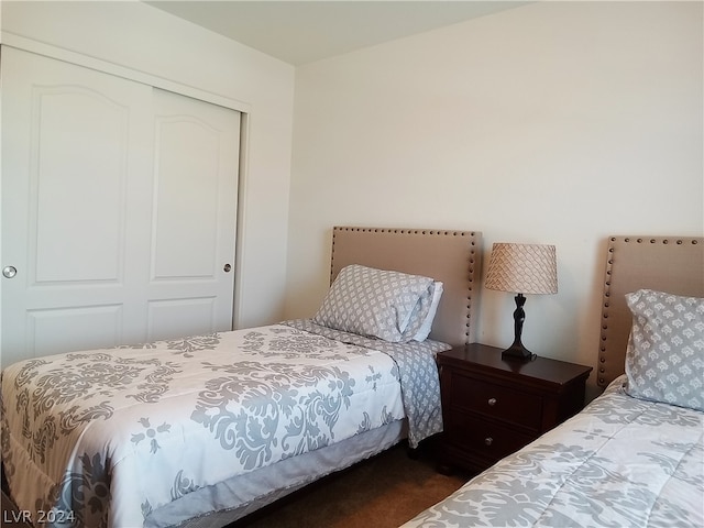 carpeted bedroom featuring a closet