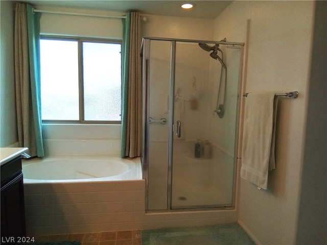 bathroom featuring vanity and plus walk in shower