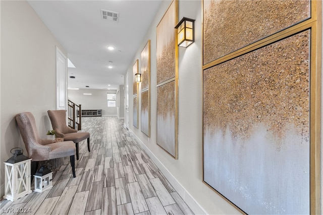 corridor featuring light hardwood / wood-style floors